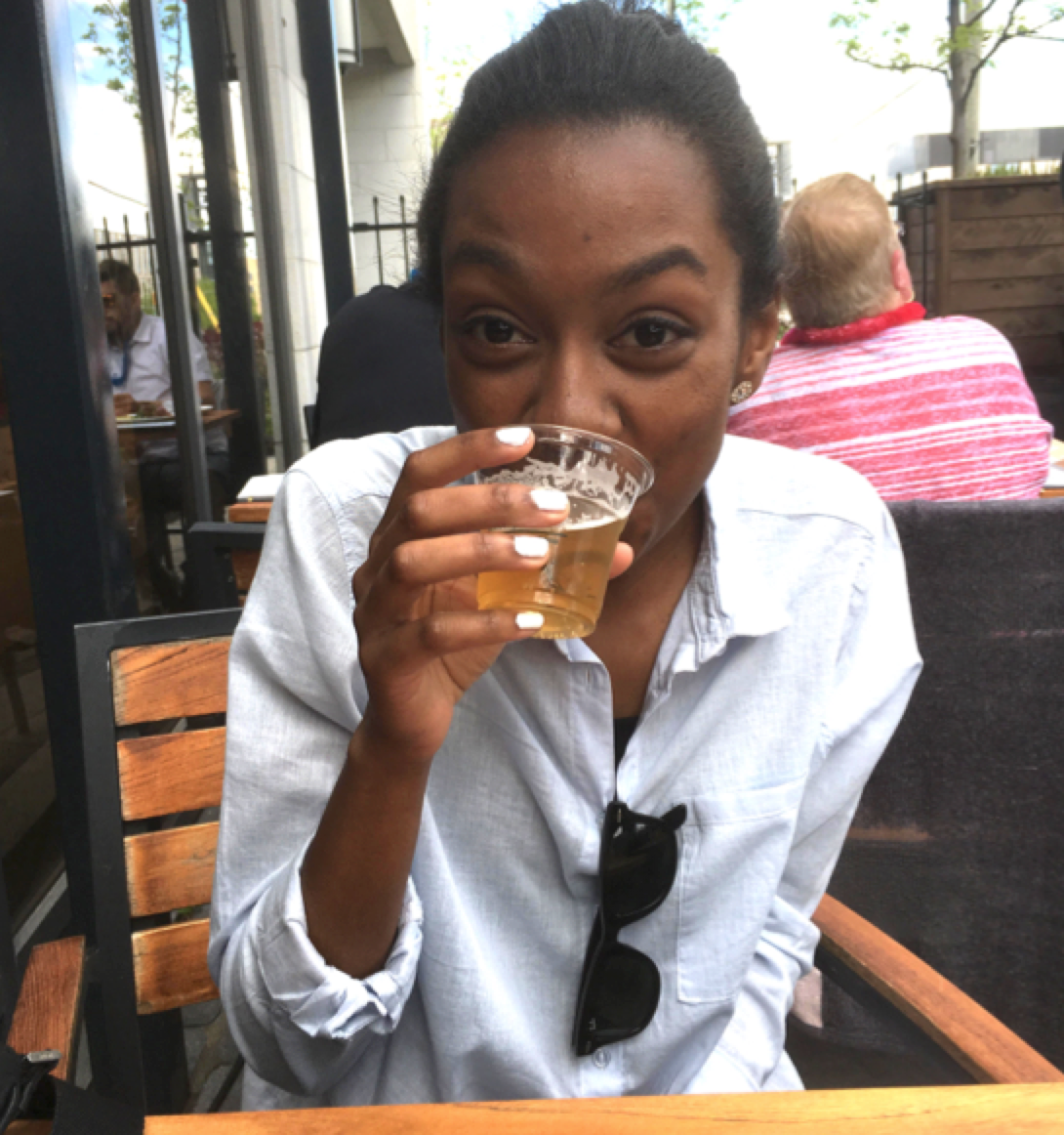 Photo of girl enjoying a drink sample on Proof's Patio