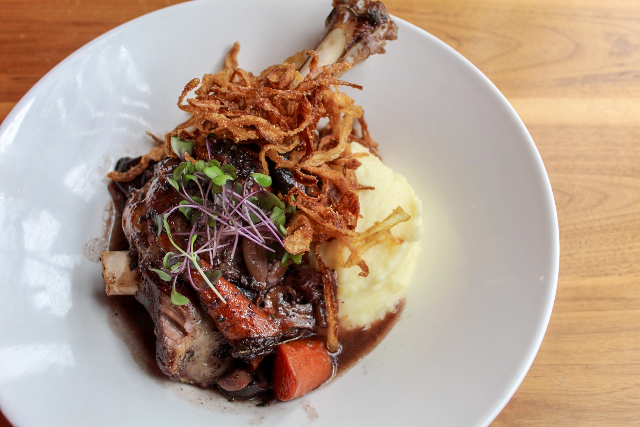 Lamb Shank dish at Proof Kitchen + Lounge in Waterloo, Ontario