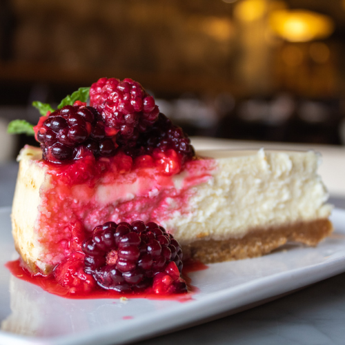 Cheesecake with boozy berries at Proof Kitchen + Lounge